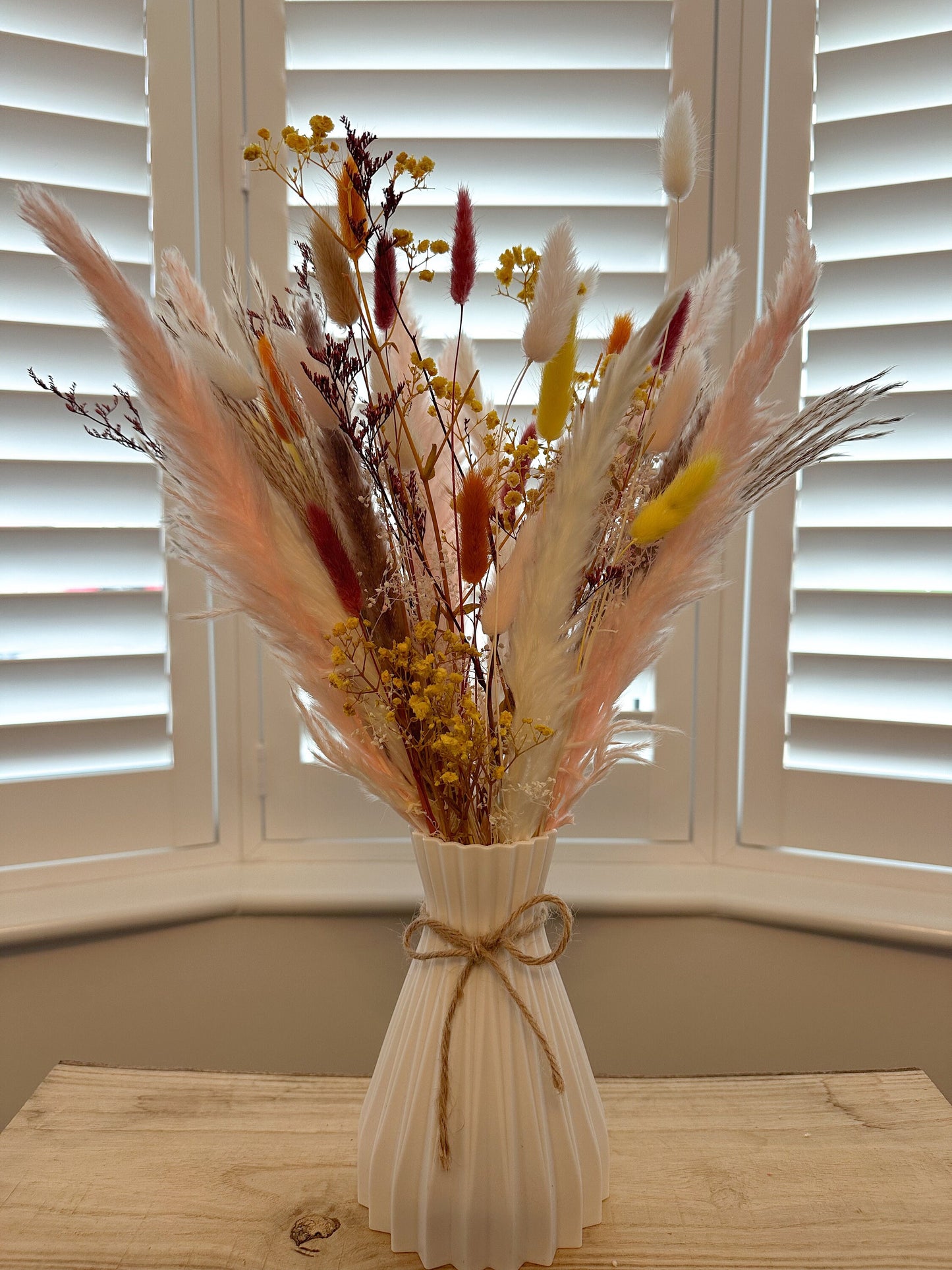 Pampas and dried floral arrangement with vase