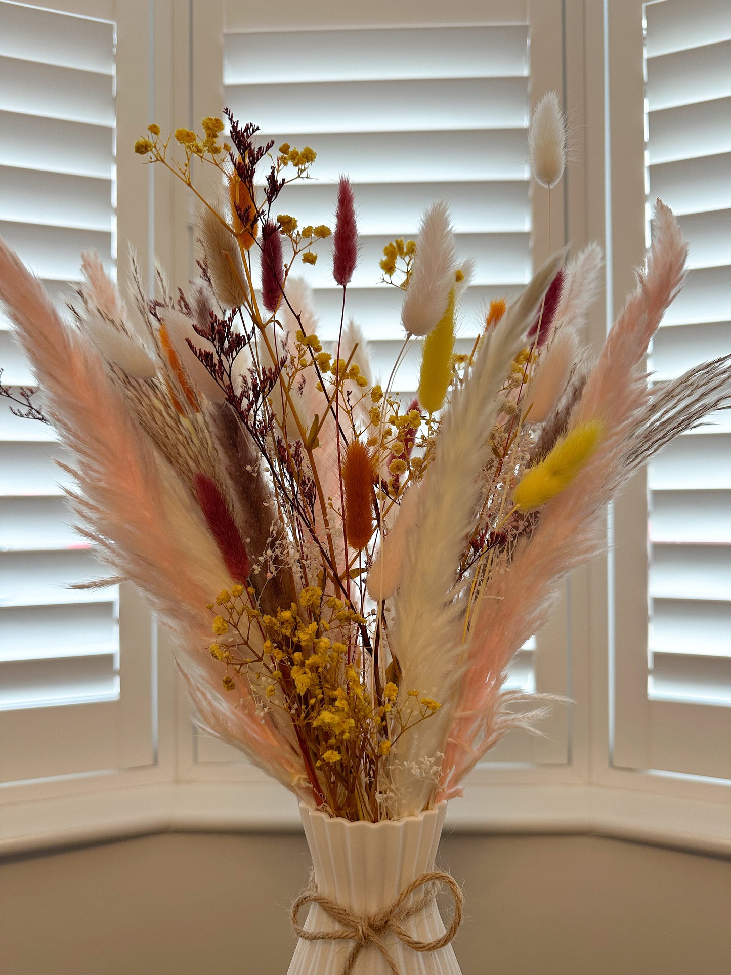 Pampas and dried floral arrangement with vase